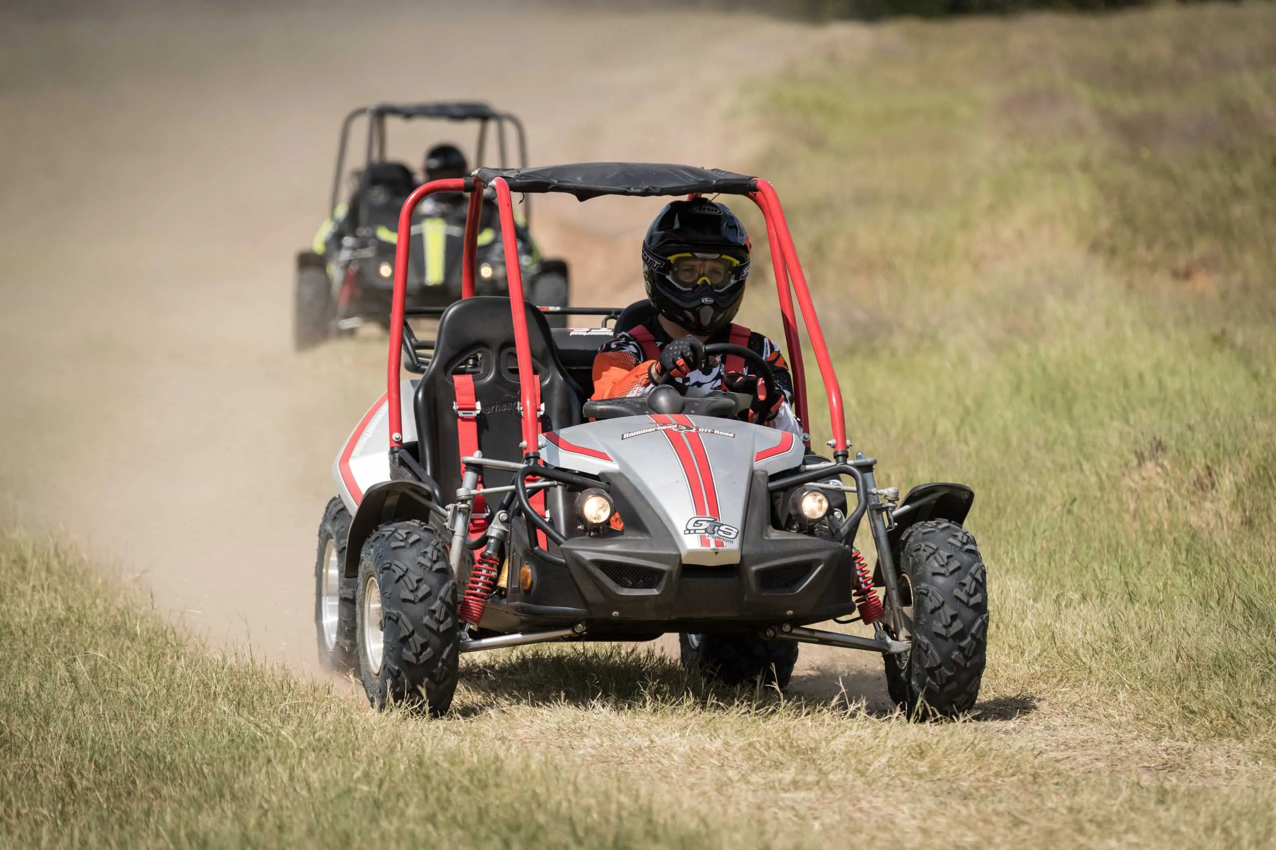 Off-road vehicles driving across a field